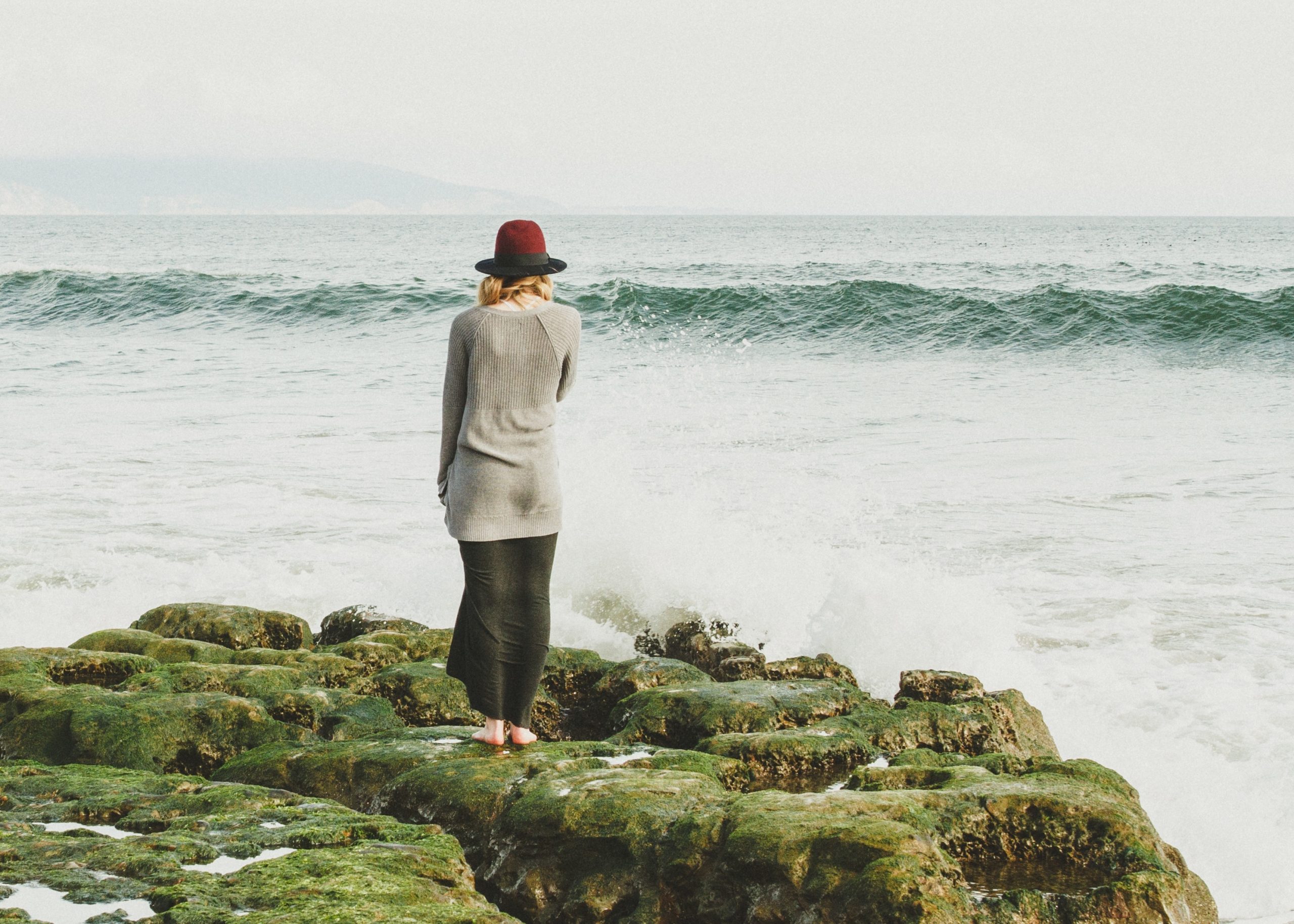 Woman staring out at sea